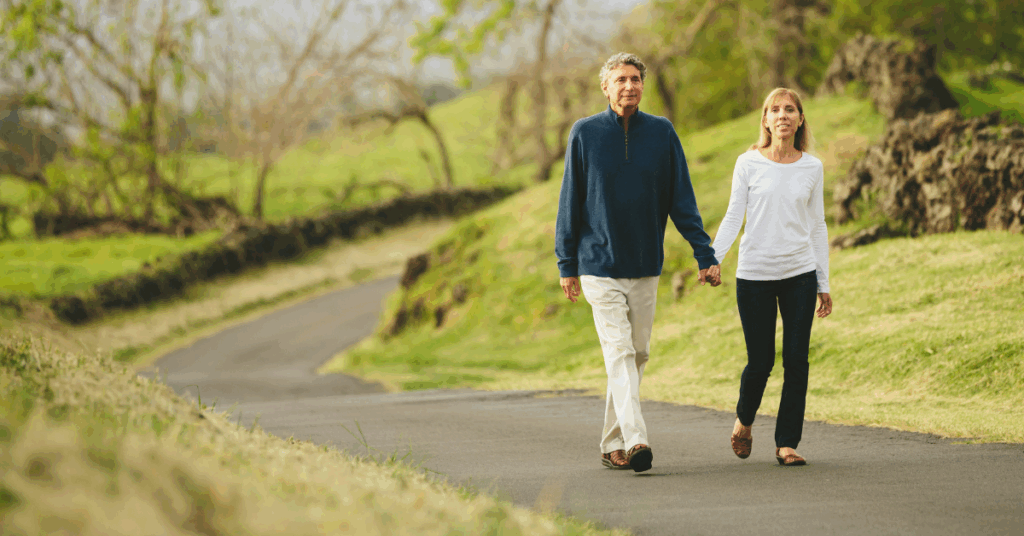 Couple walking on a quiet path together, illustrating the peace of mind that comes from keeping your estate plan updated.