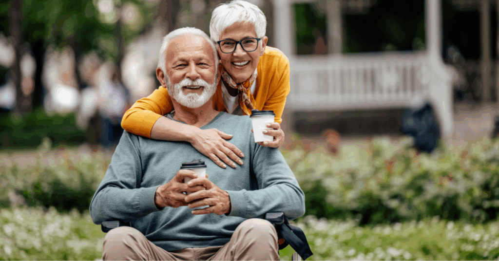 Older couple enjoying coffee outdoors, reflecting on values and purpose while planning charitable giving in retirement.