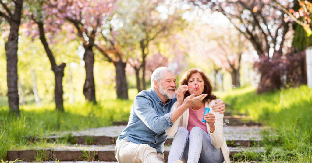 Couple discussing retirement spending plans together outside.